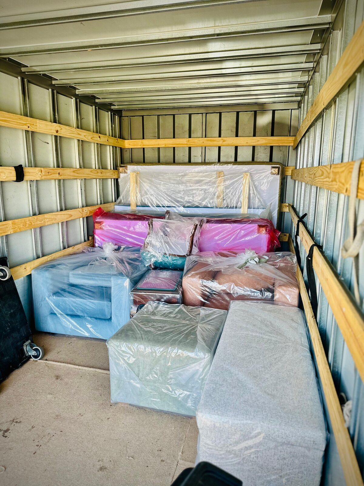A RemovALL truck carefully packed with wrapped furniture